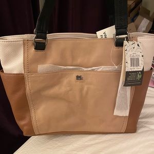 The New Sak tote. New Brown, tan, cream, & black handles.